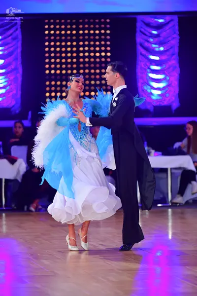 Dancesport competitor: Male dancer: black ballroom tailcoat suit