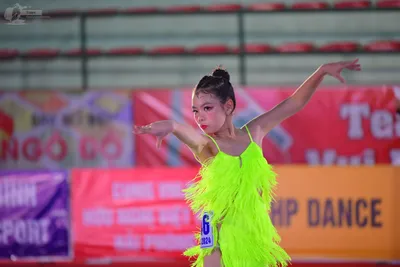 Dancesport competitor: ** Female: Bright Yellow Latin Dress
*   **Color:** Bright Yellow
*   **Fabric:*