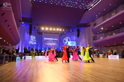 Dancesport competitor: Female dancer: pink latin dress with long fringe