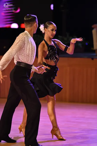 Dancesport competitor: ** Black fitted suit