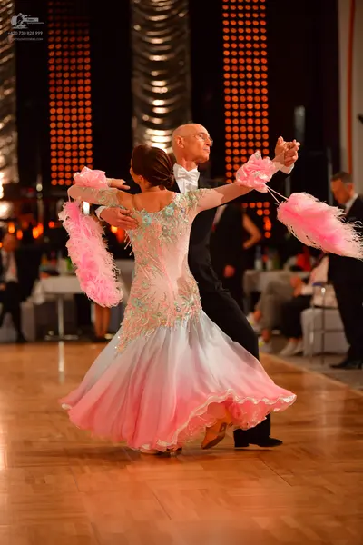 Dancesport competitor: Male dancer: black suit with a white bowtie