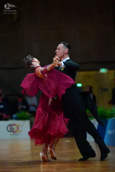 Dancesport competitor: Male dancer: black suit and black shoes