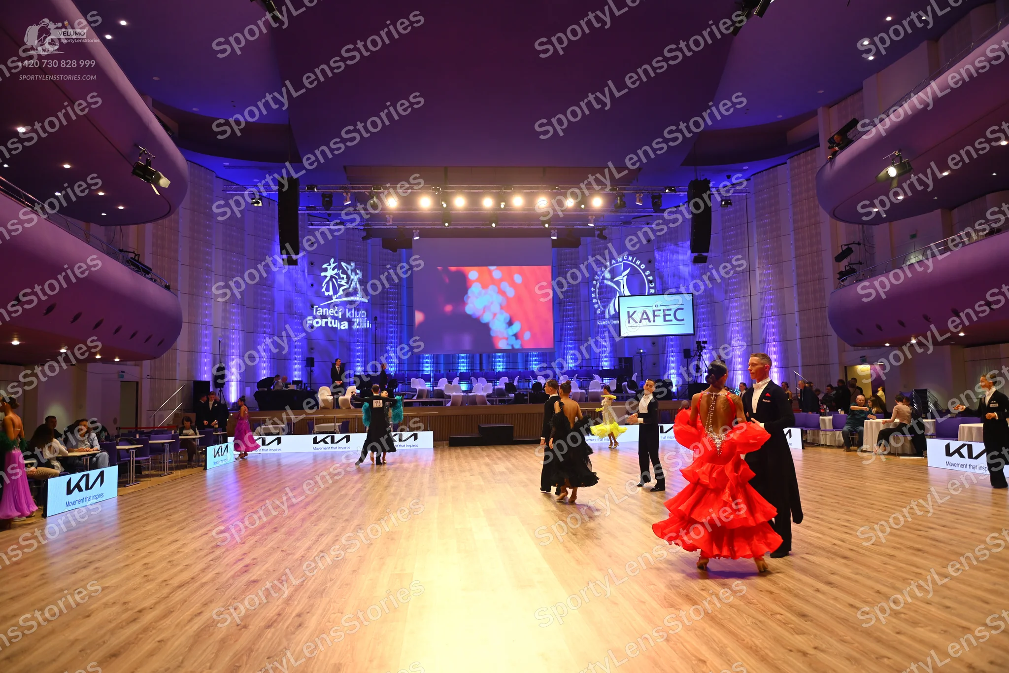 Dancesport competitor: Female dancer: purple satin-like dress