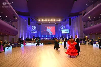 Dancesport competitor: Female dancer: purple satin-like dress