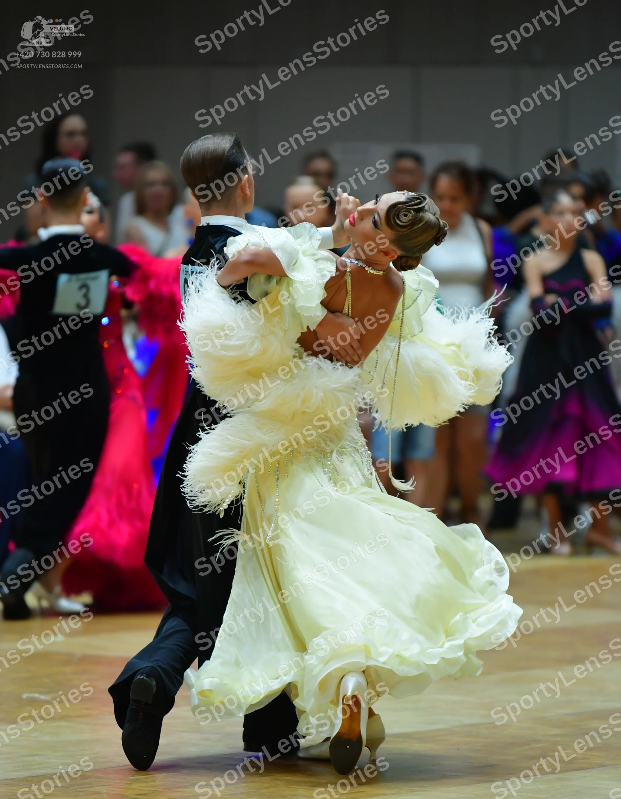 Dancesport competitor: Male dancers: black suits with white shirts
