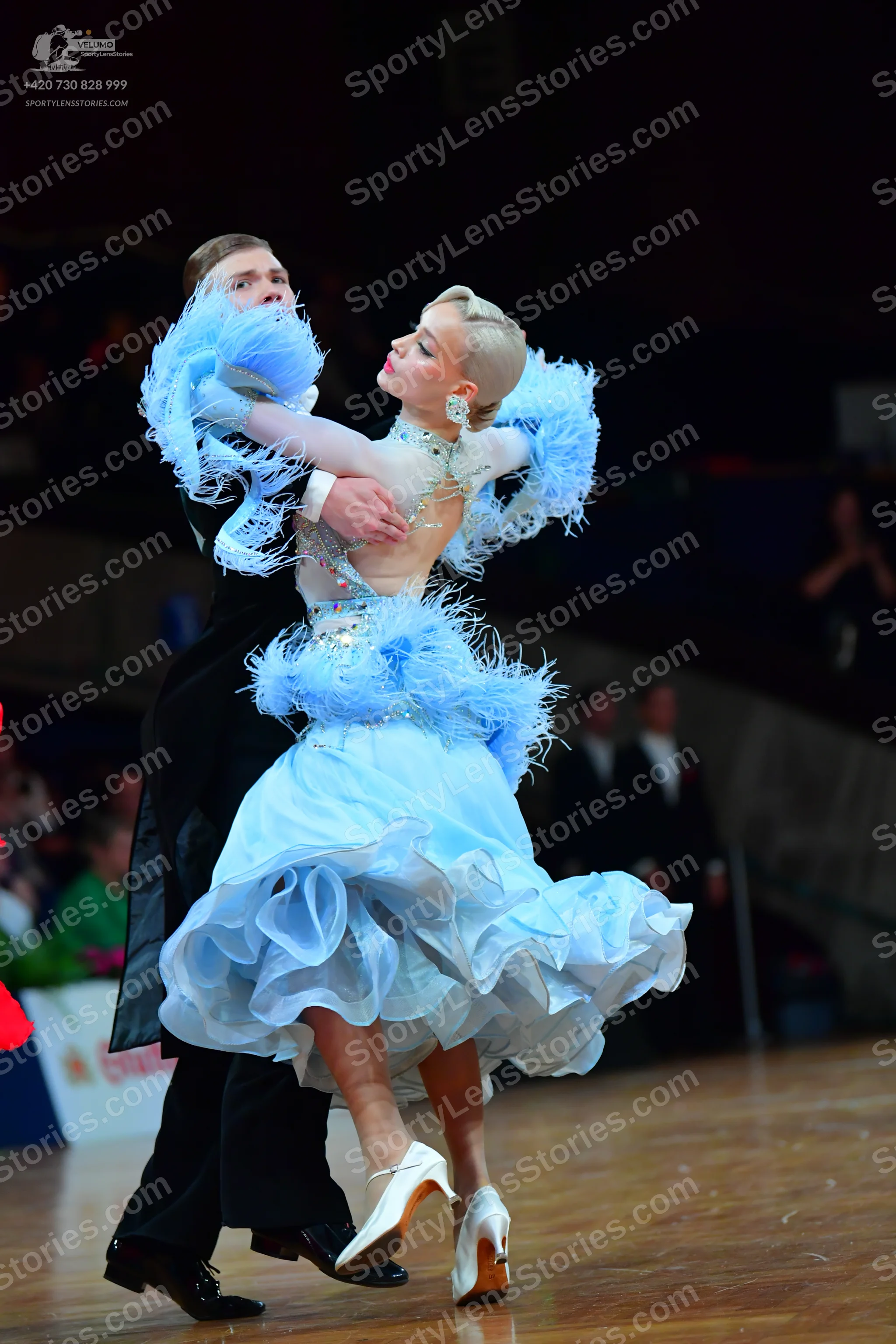 Dancesport competitor: ** Black tail suit with wide, black sequin lapels and a slim, fitted body