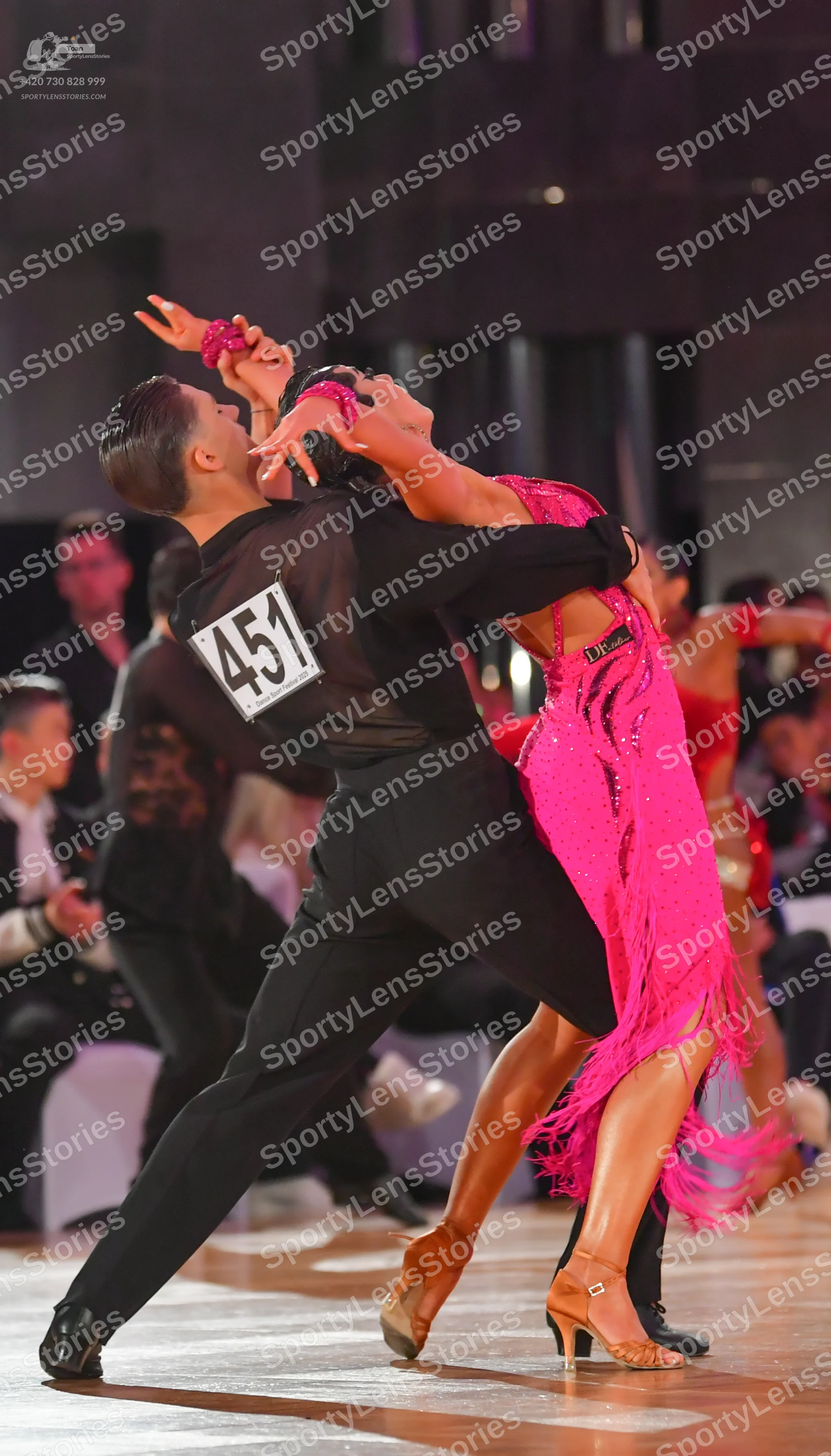 Dancesport competitor: ** Black tail suit with silver sequin lapels