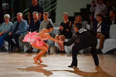 Dancesport competitor #60: Female dancer: pink ruffled latin dress