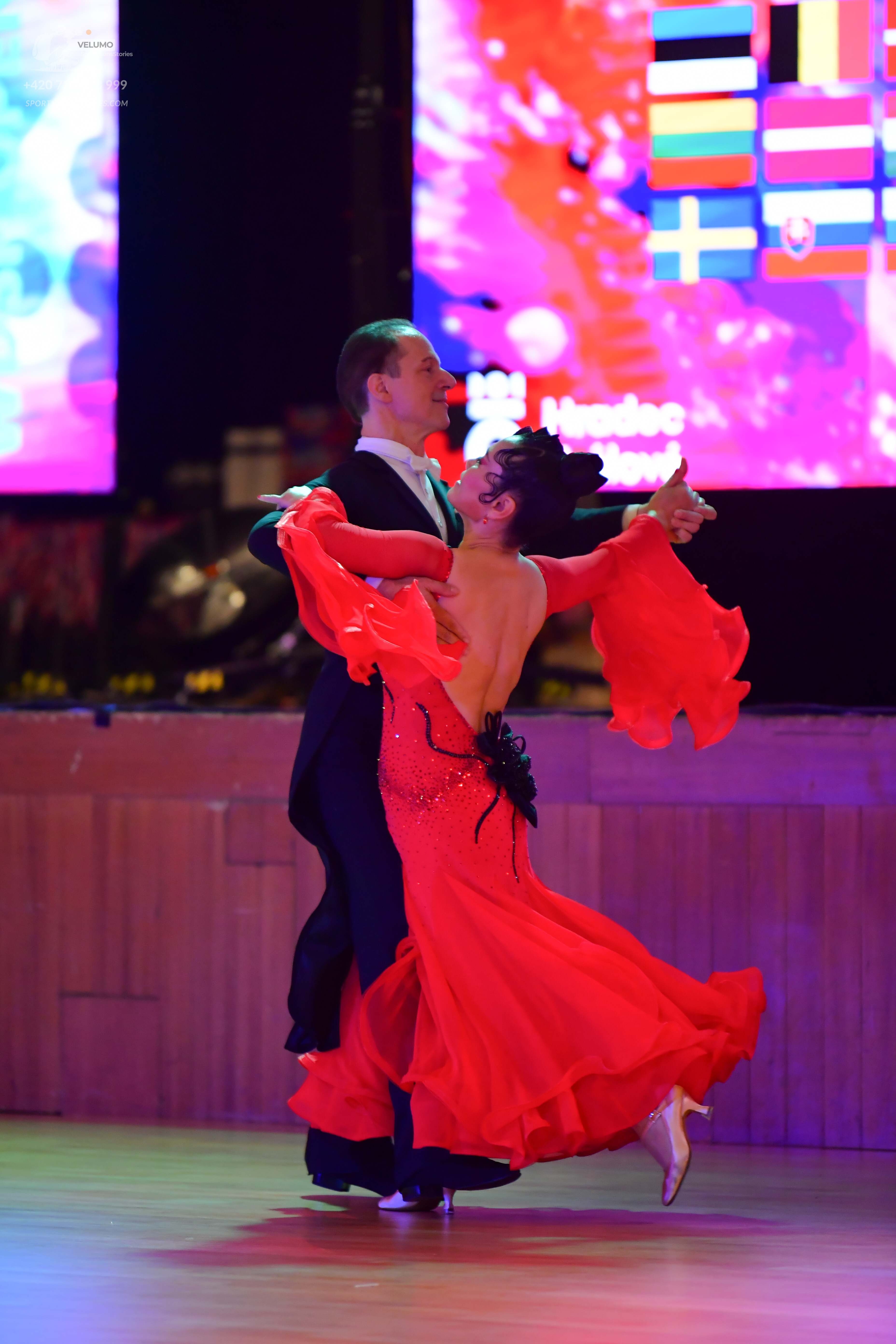 Dancesport competitor: Male dancer: black ballroom suit with a white shirt and black bow tie