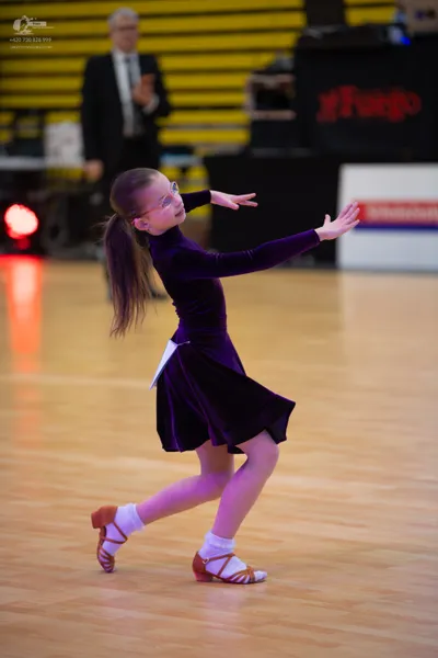 Dancesport competitor: ** Velvet dress - Deep burgundy or dark red color