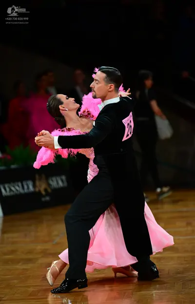 Dancesport competitor #26: Male dancer: black long-sleeved top and black trousers