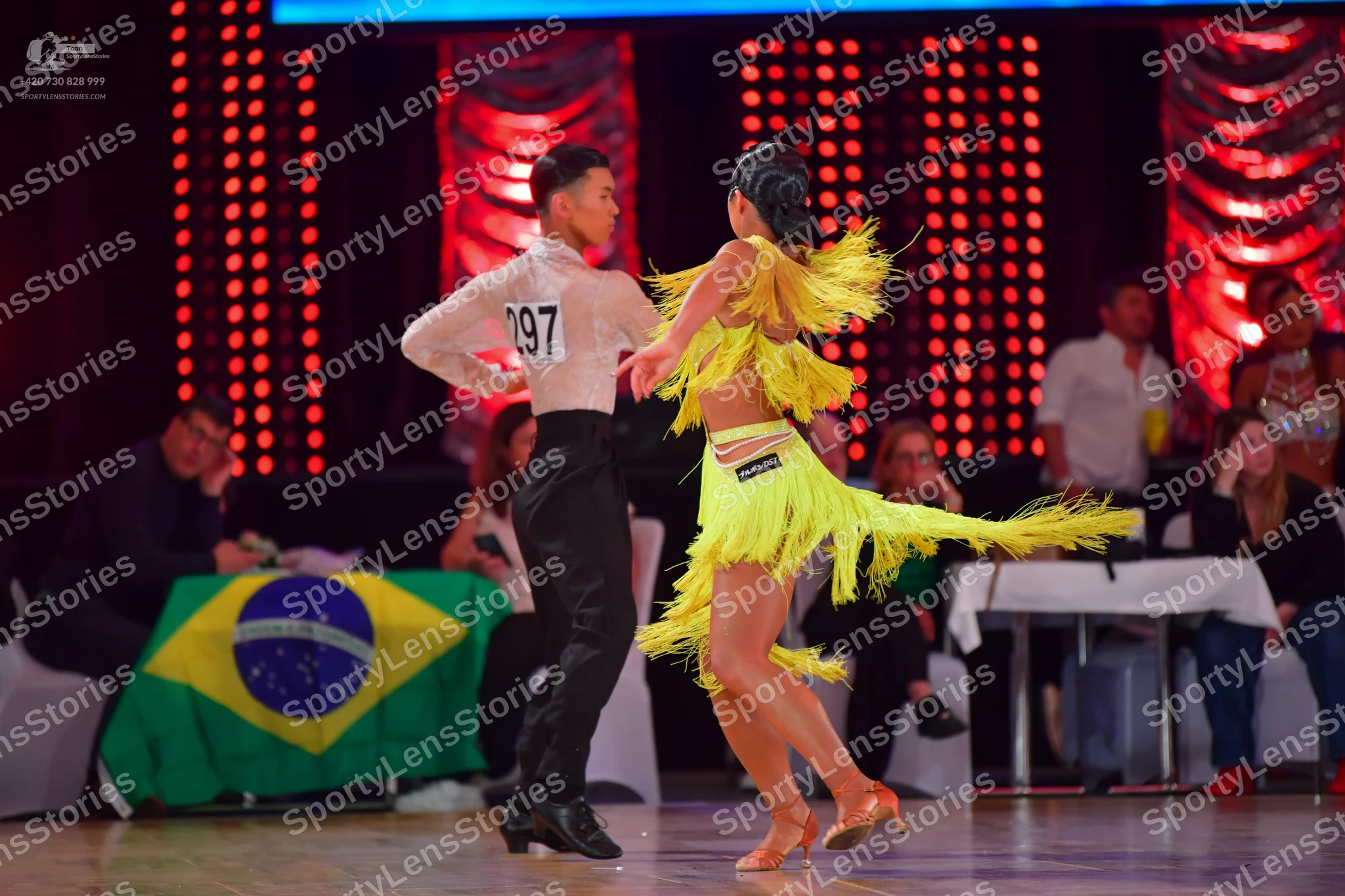 Dancesport competitor #297: Male dancer: light-colored long-sleeved shirt and black trousers