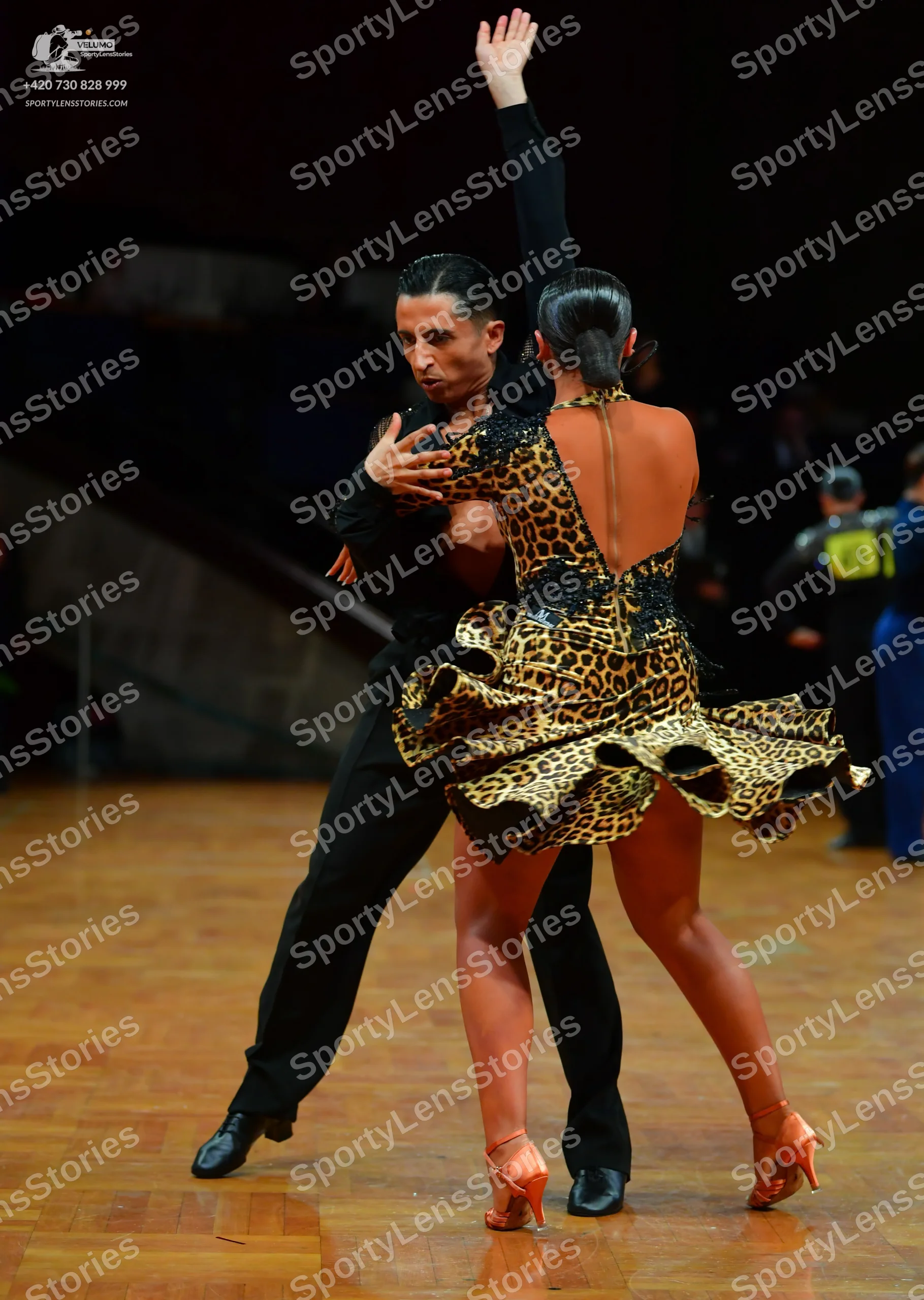 Dancesport competitor: Male dancer: black long-sleeved shirt and black trousers
