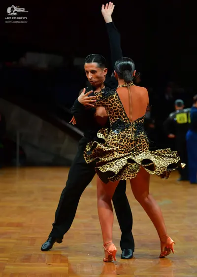 Dancesport competitor: Male dancer: black long-sleeved shirt and black trousers
