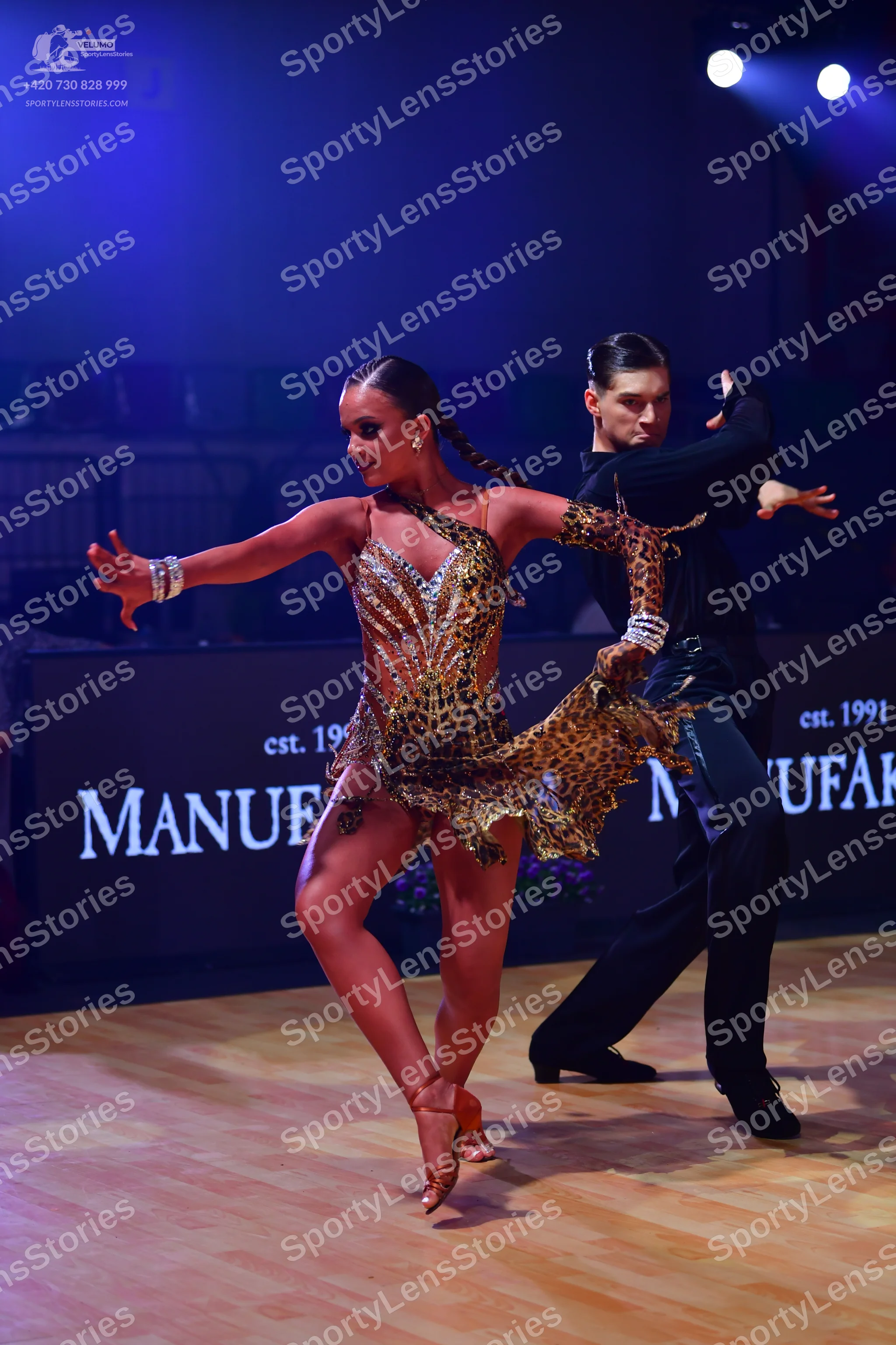 Dancesport competitor: Female dancer: leopard print latin dress with heavy sequin and crystal embellish