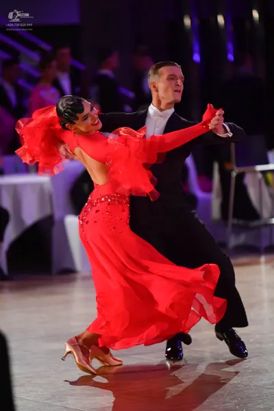 Dancesport competitor: Male dancer: black suit with a white shirt and black shoes