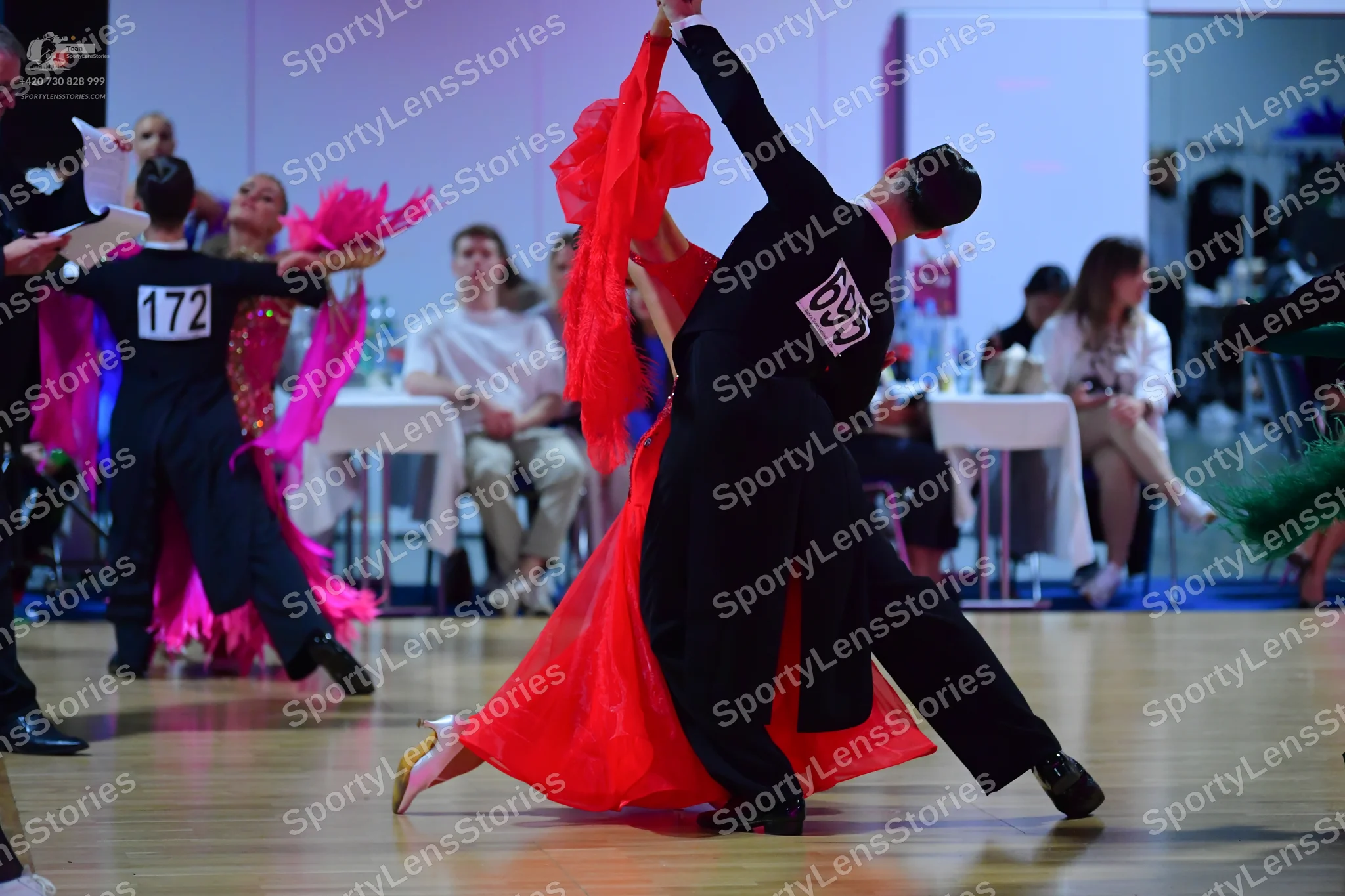 Dancesport competitor #172, #69: Male dancer (left): black top and dark blue trousers