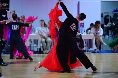 Dancesport competitor #172, #69: Male dancer (left): black top and dark blue trousers