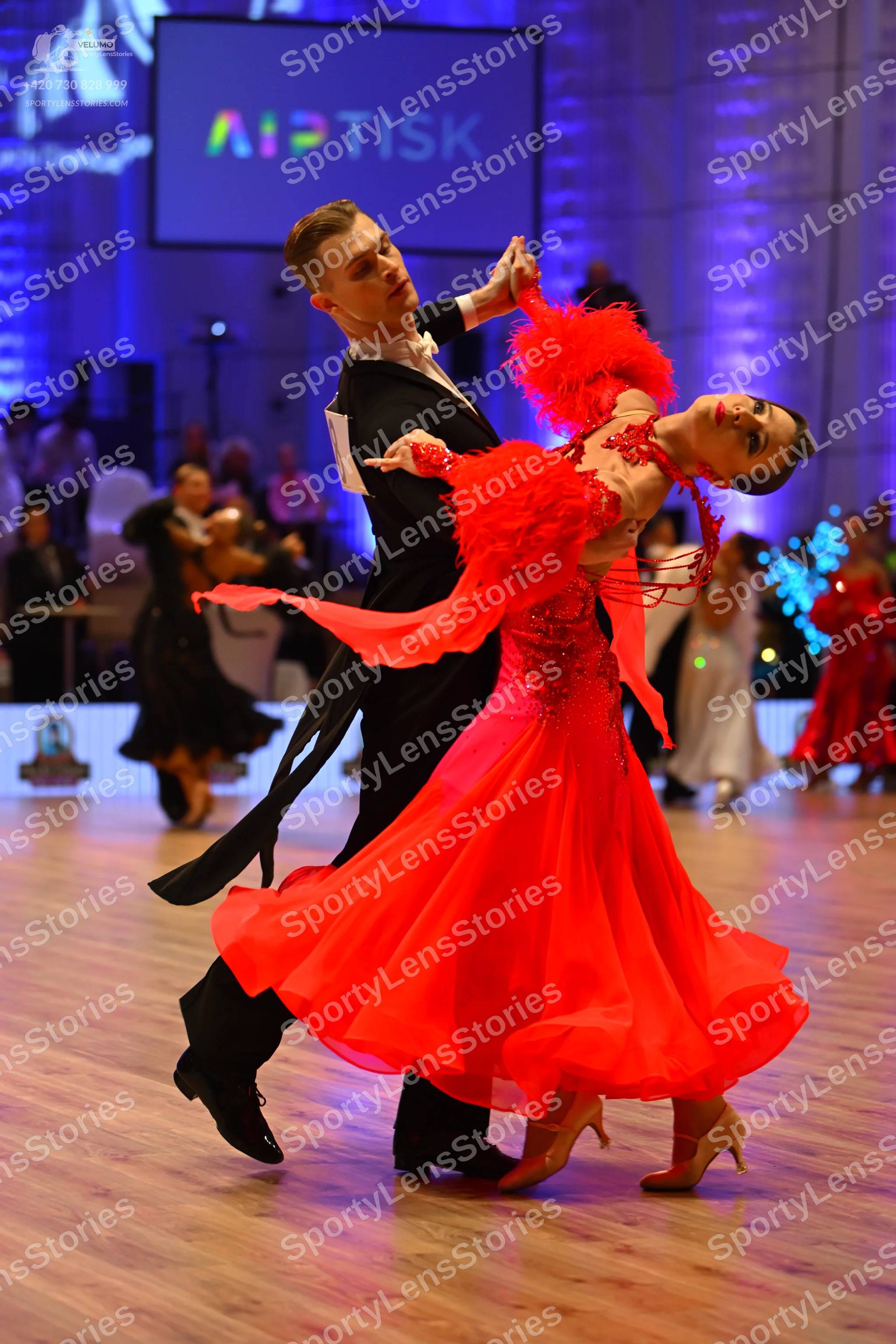 Dancesport competitor: Male dancer: black suit with a white shirt and black bowtie