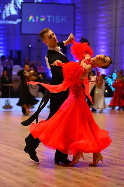 Dancesport competitor: Male dancer: black suit with a white shirt and black bowtie