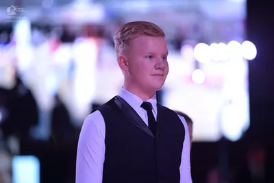 Dancesport competitor: ** Male: Black tail suit with white sequin lapels and a white shirt
