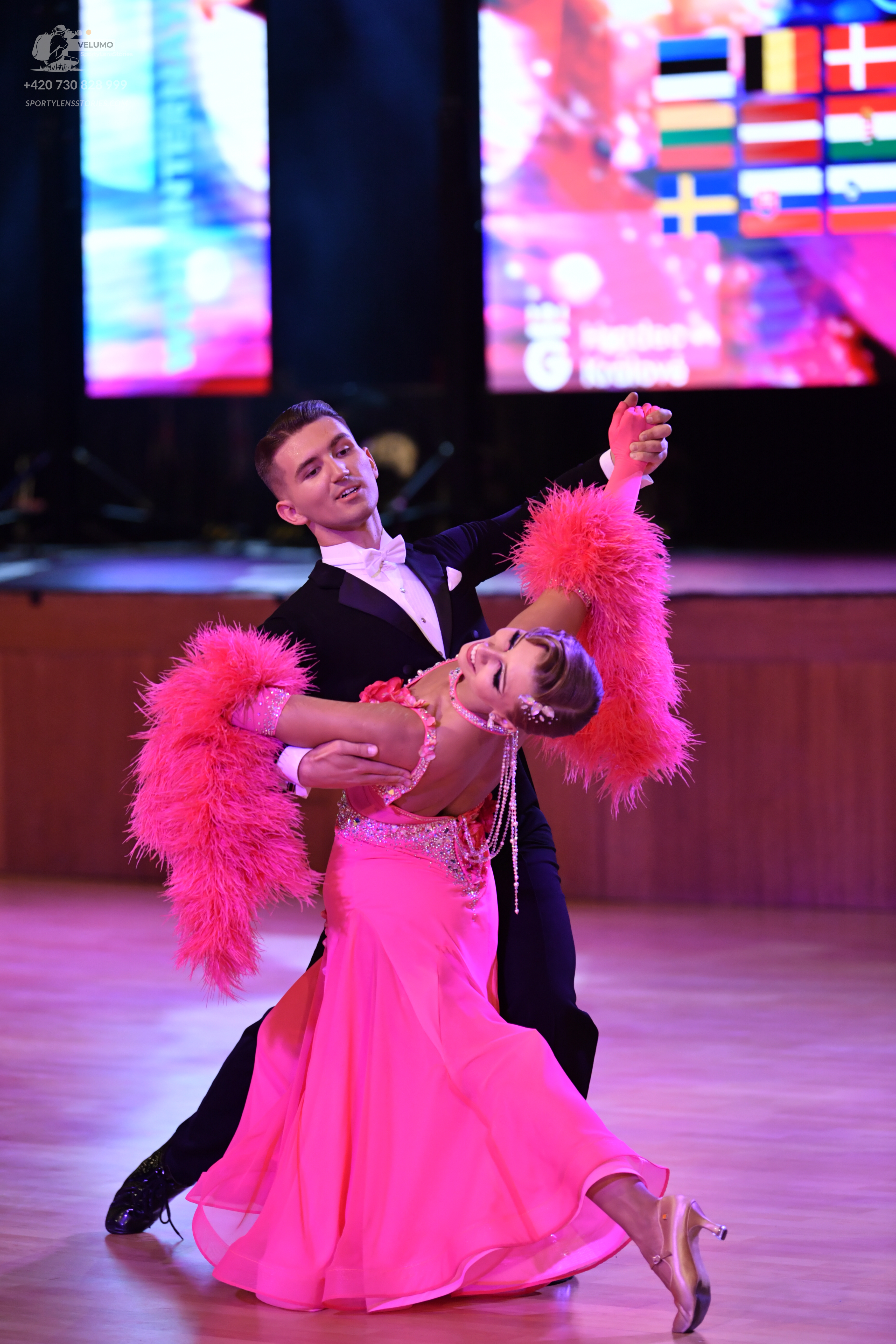 Dancesport competitor: Male dancer: black suit with a white shirt and white bowtie