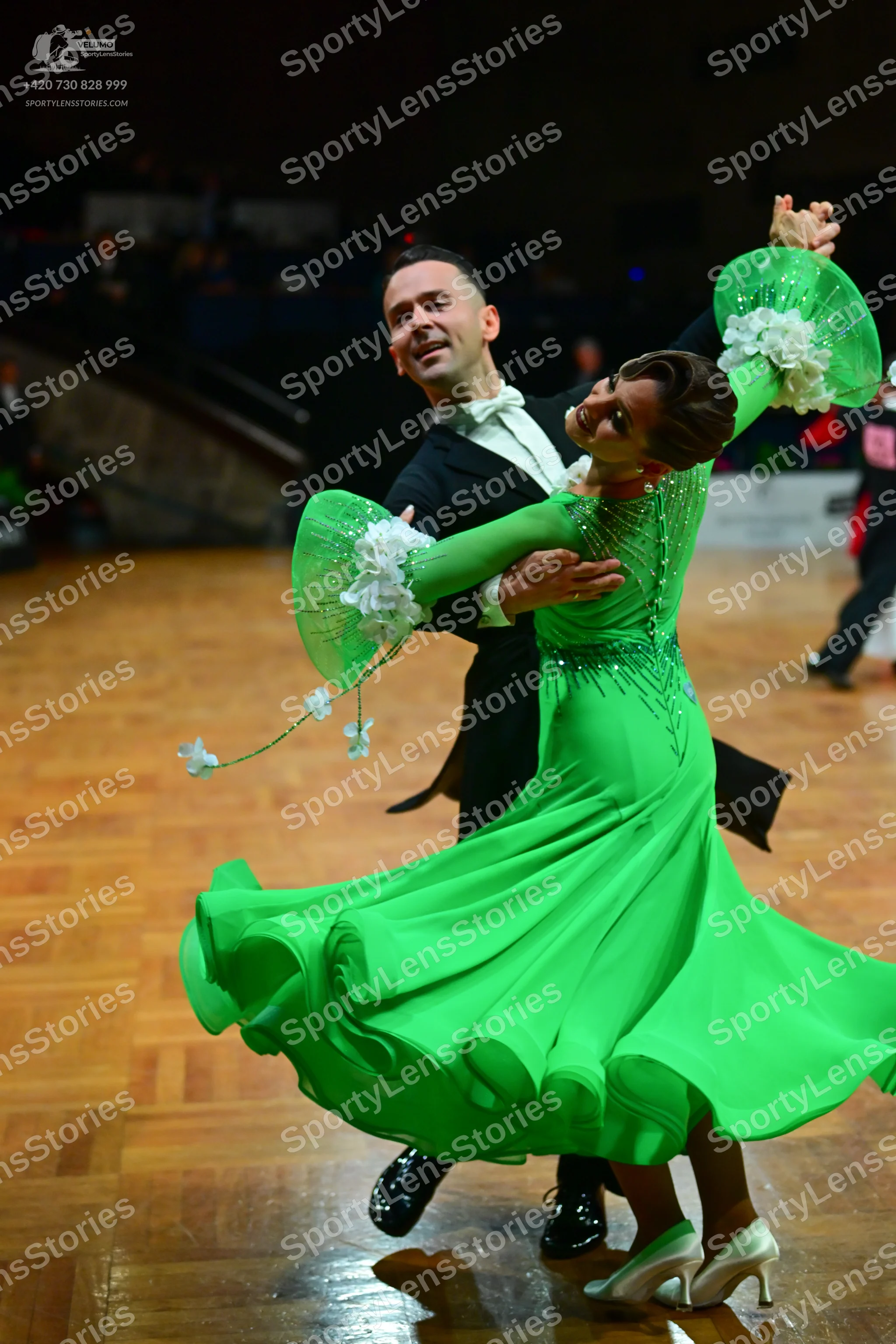 Dancesport competitor: Male dancer: black ballroom suit with a white shirt and white bowtie