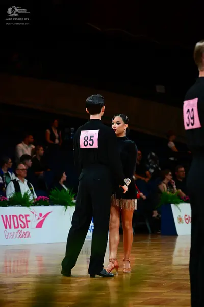 Dancesport competitor #85, #39: Male dancer: black long-sleeve shirt and black trousers