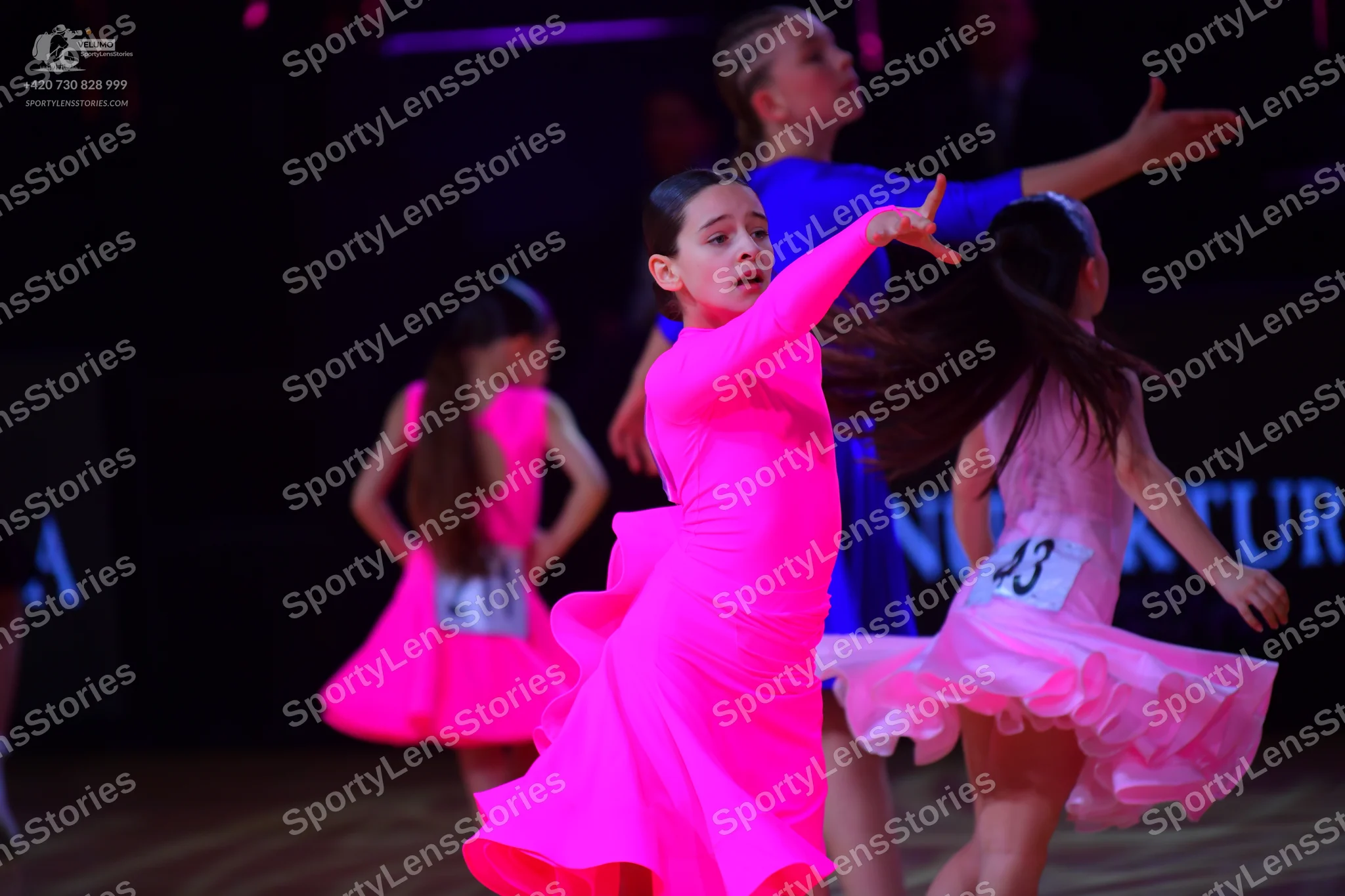 Dancesport competitor: Female dancer: pink latin dress