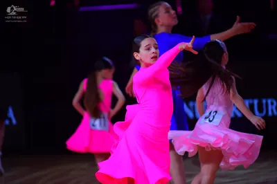 Dancesport competitor: Female dancer: pink latin dress