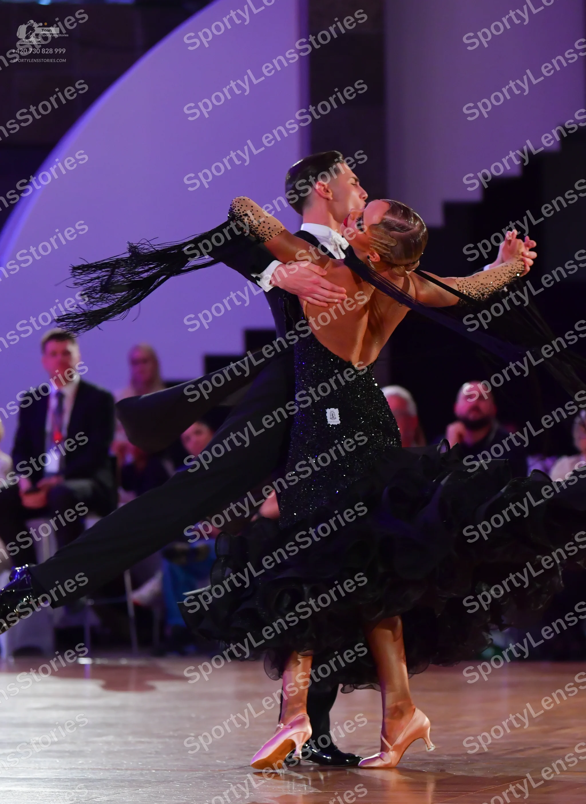 Dancesport competitor: Male dancer: black suit