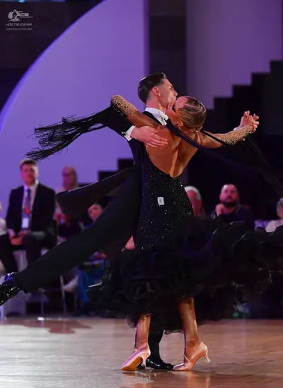 Dancesport competitor: Male dancer: black suit