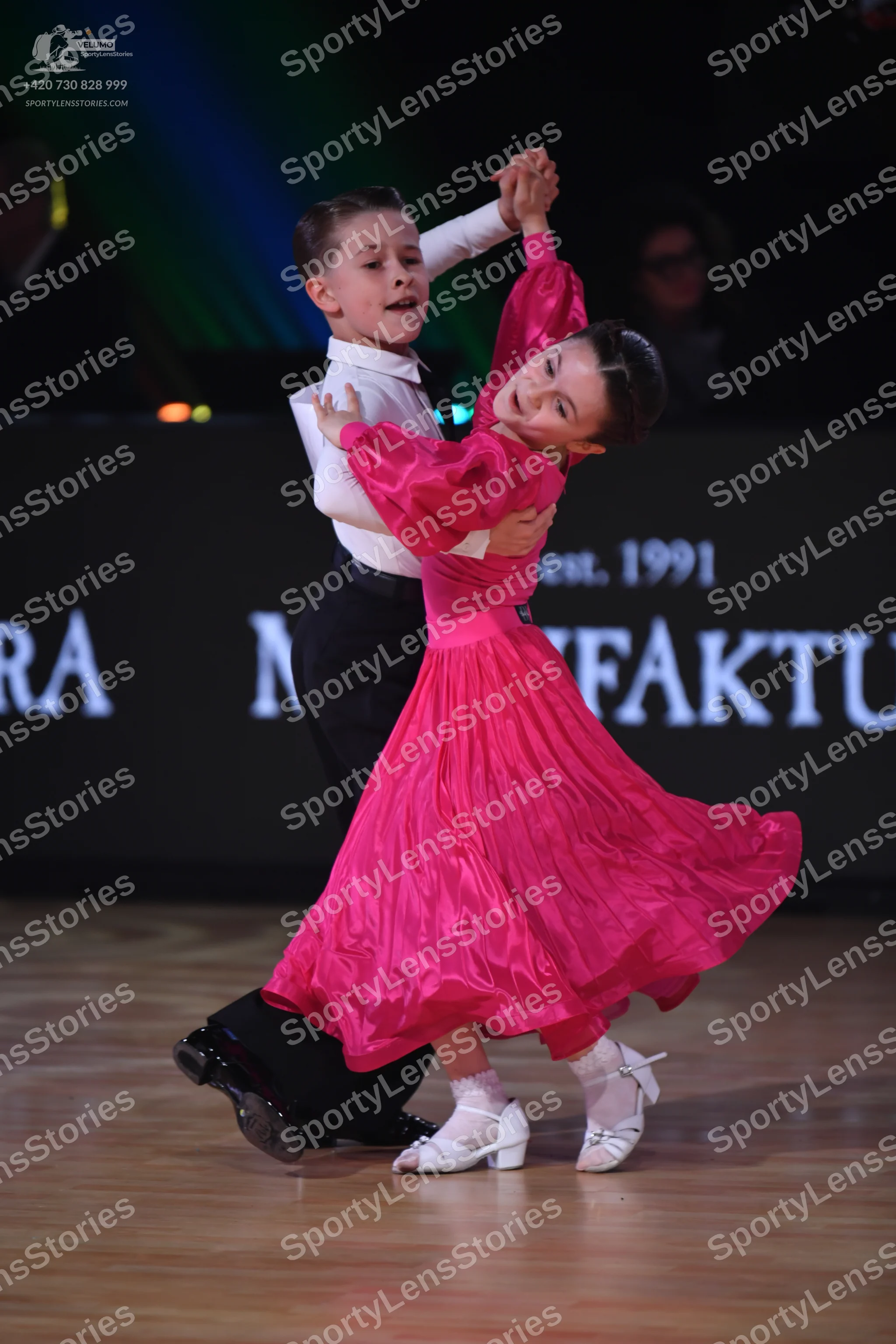 Dancesport competitor: Male dancer: white long-sleeved shirt and black trousers