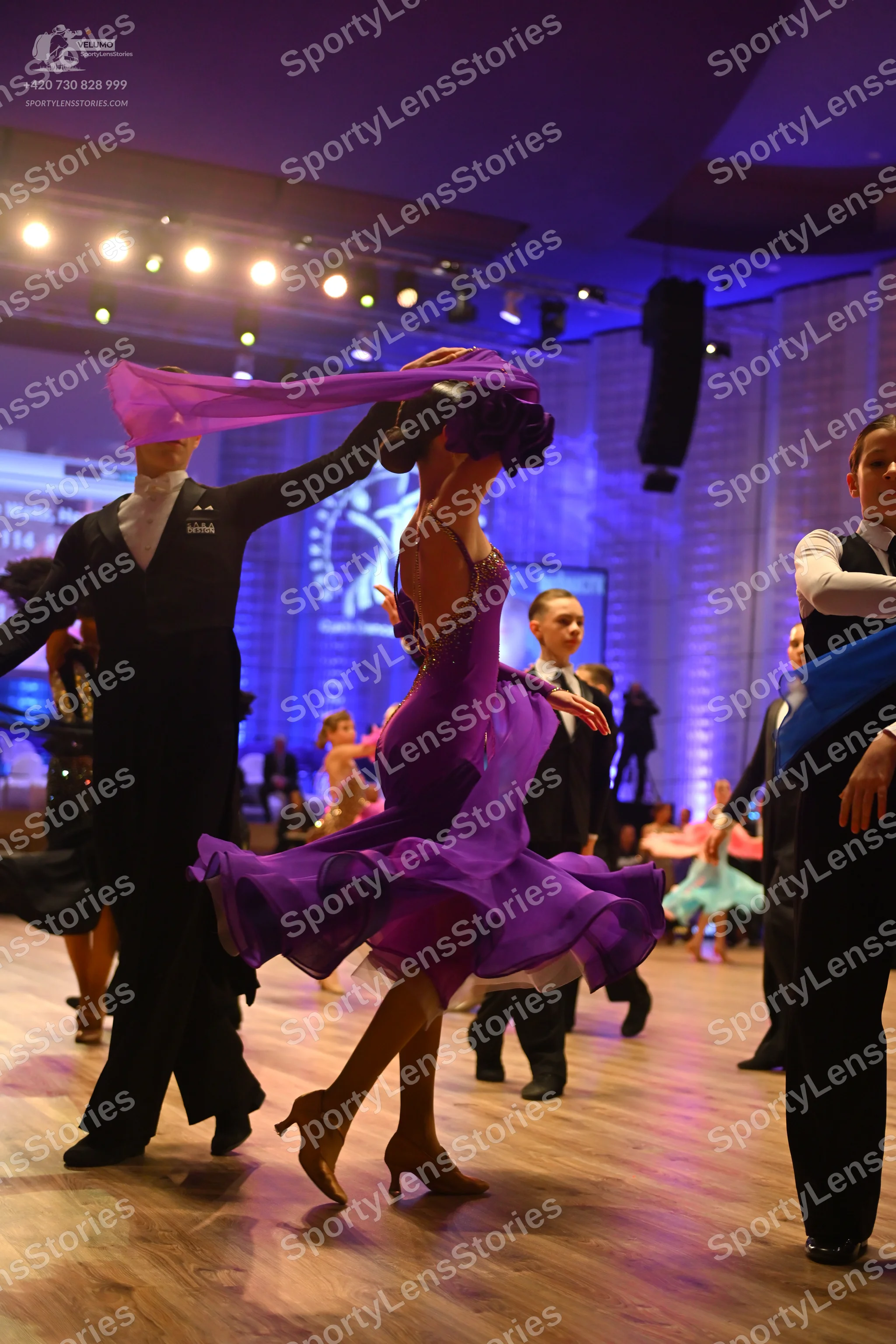 Dancesport competitor: Male dancer (left): black long-sleeved shirt and black trousers