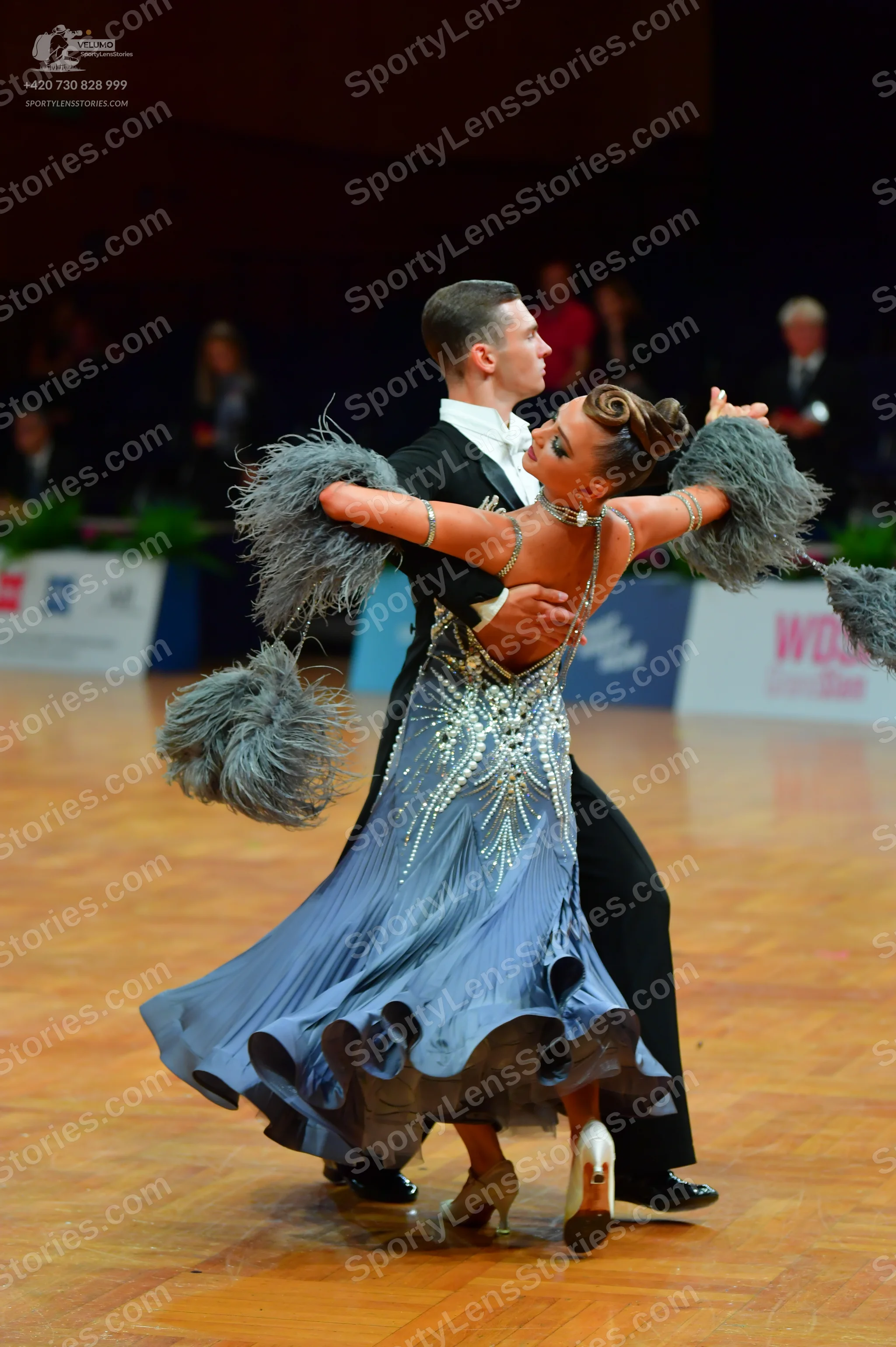 Dancesport competitor: Male dancer: black suit with a white shirt and white bowtie