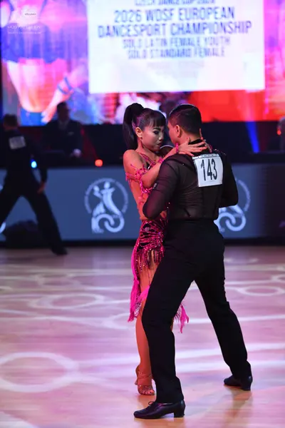 Dancesport competitor: Male dancer: black long-sleeved mesh shirt and black trousers