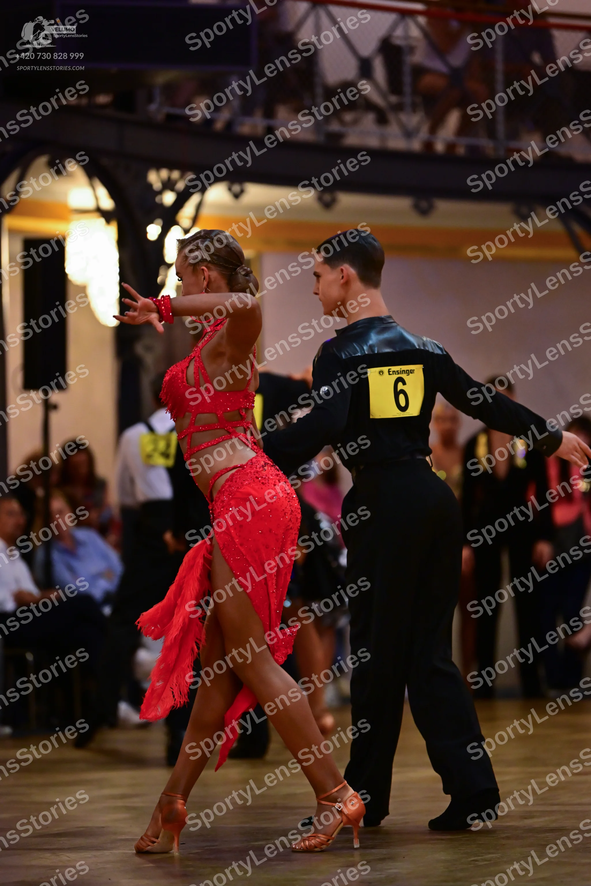 Dancesport competitor: Female dancer: red latin dress with cutouts