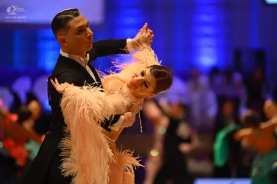 Dancesport competitor: Male dancer: black ballroom tailcoat with a white shirt underneath