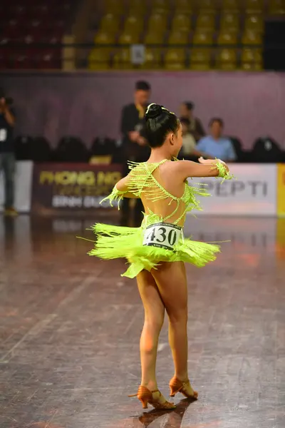 Dancesport competitor #430: Female dancer: neon green latin dress with fringe