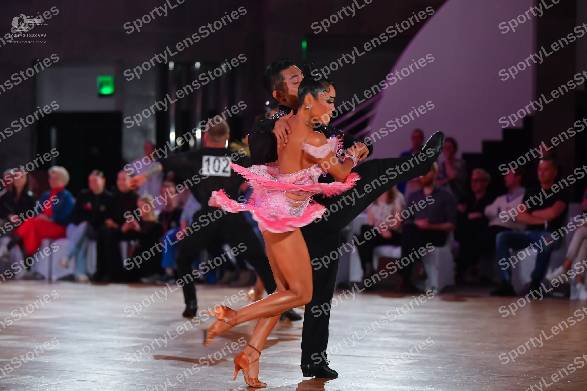 Dancesport competitor #102: Female dancer: pink latin dress with ruffles