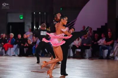 Dancesport competitor #102: Female dancer: pink latin dress with ruffles