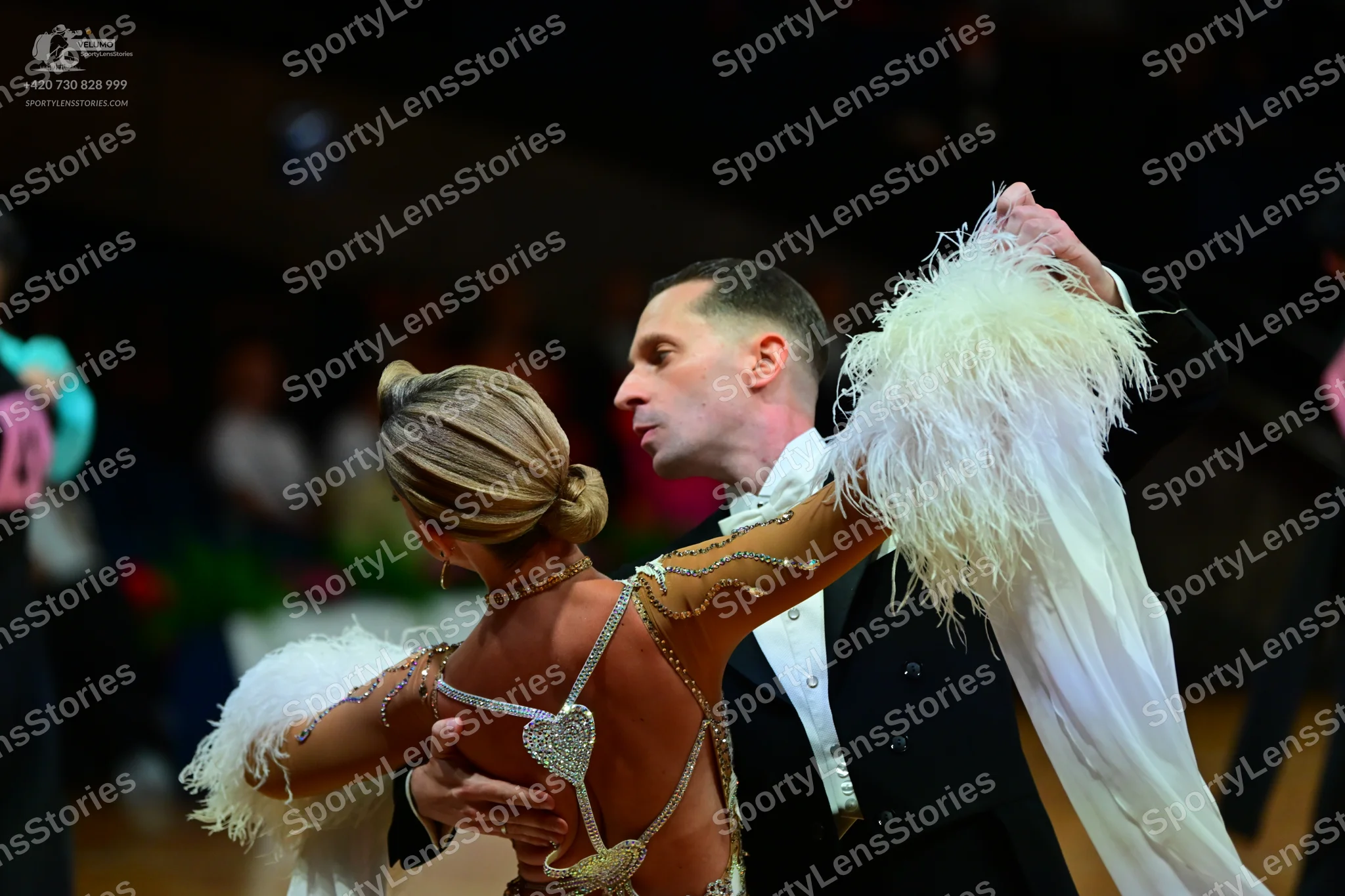 Dancesport competitor: Male dancer: black suit with a white shirt