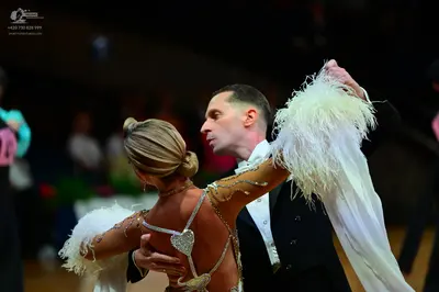 Dancesport competitor: Male dancer: black suit with a white shirt
