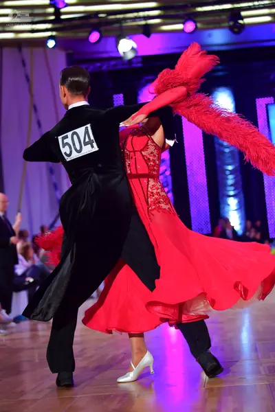 Dancesport competitor #504: Male dancer: black tailcoat and black trousers
