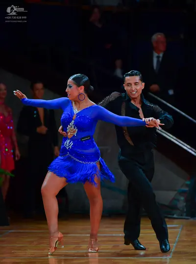 Dancesport competitor: Male dancer: black long-sleeved shirt with a subtle texture and black trousers