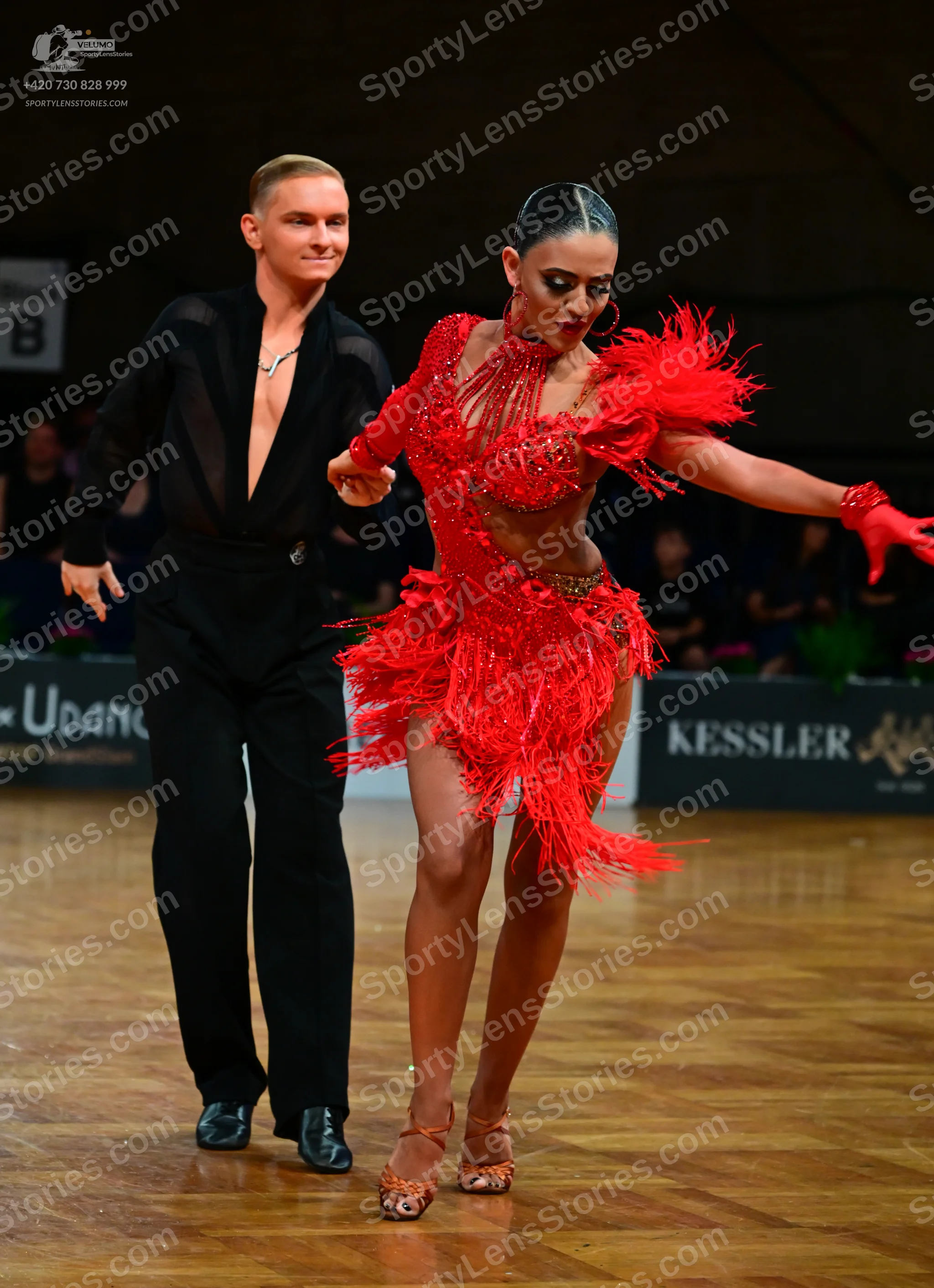 Dancesport competitor: Male dancer: black long-sleeved shirt with a deep V-neck and black trousers