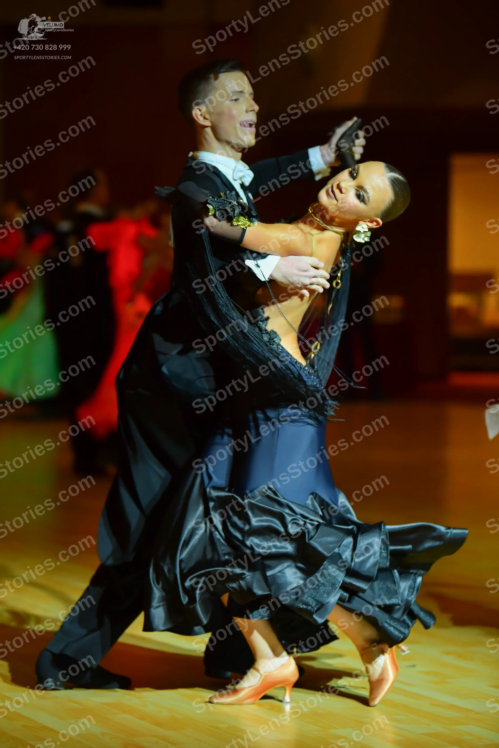 Dancesport competitor: Male dancer: black ballroom tailcoat, white shirt, white bowtie, and black trous