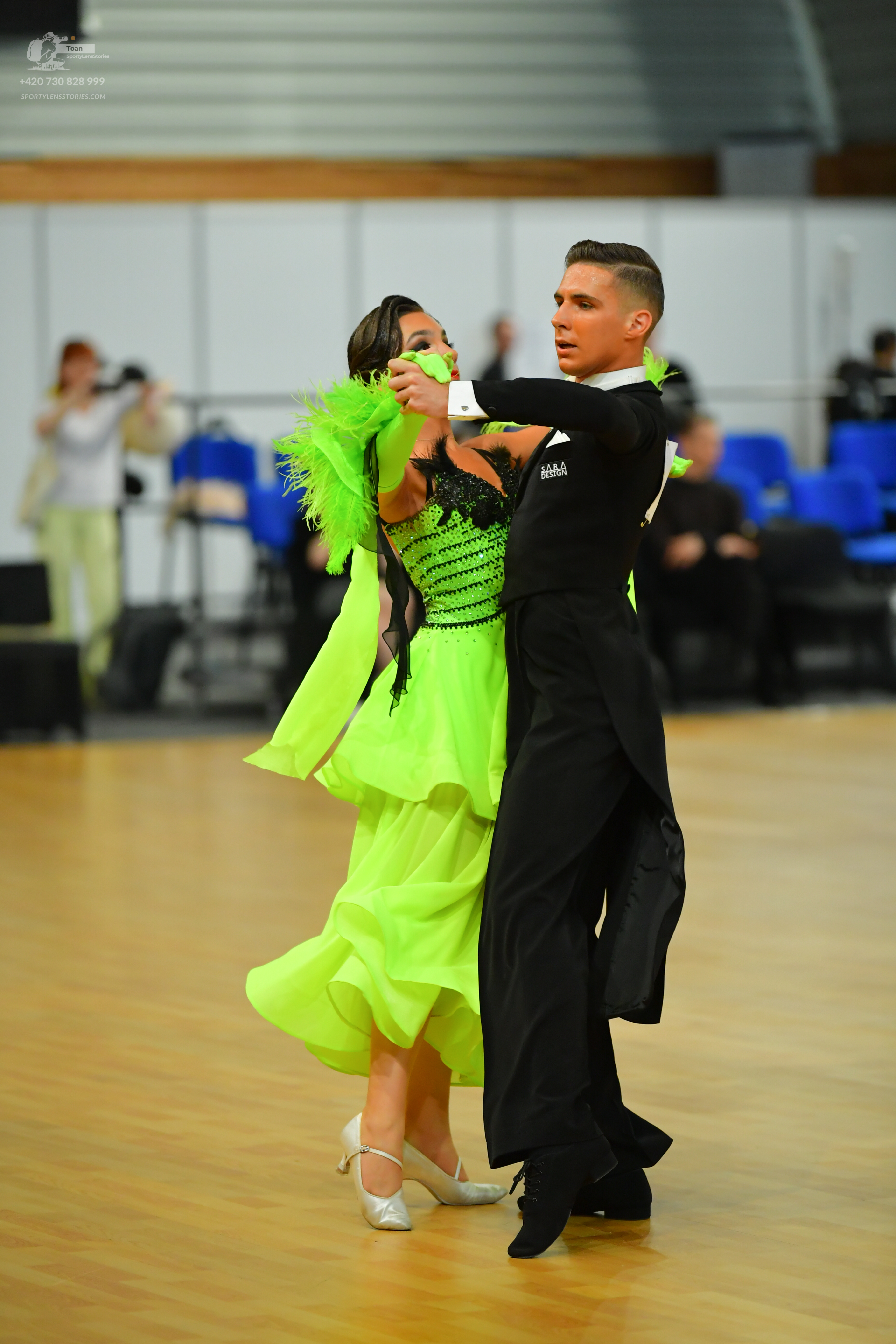 Dancesport competitor: Male**
*   **Color:** Black
*   **Fabric:** Likely satin or a smooth synthetic f
