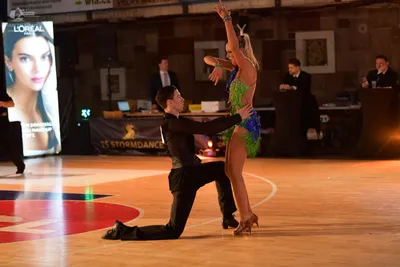 Dancesport competitor: ** Black suit with a high collar and sequin lapels