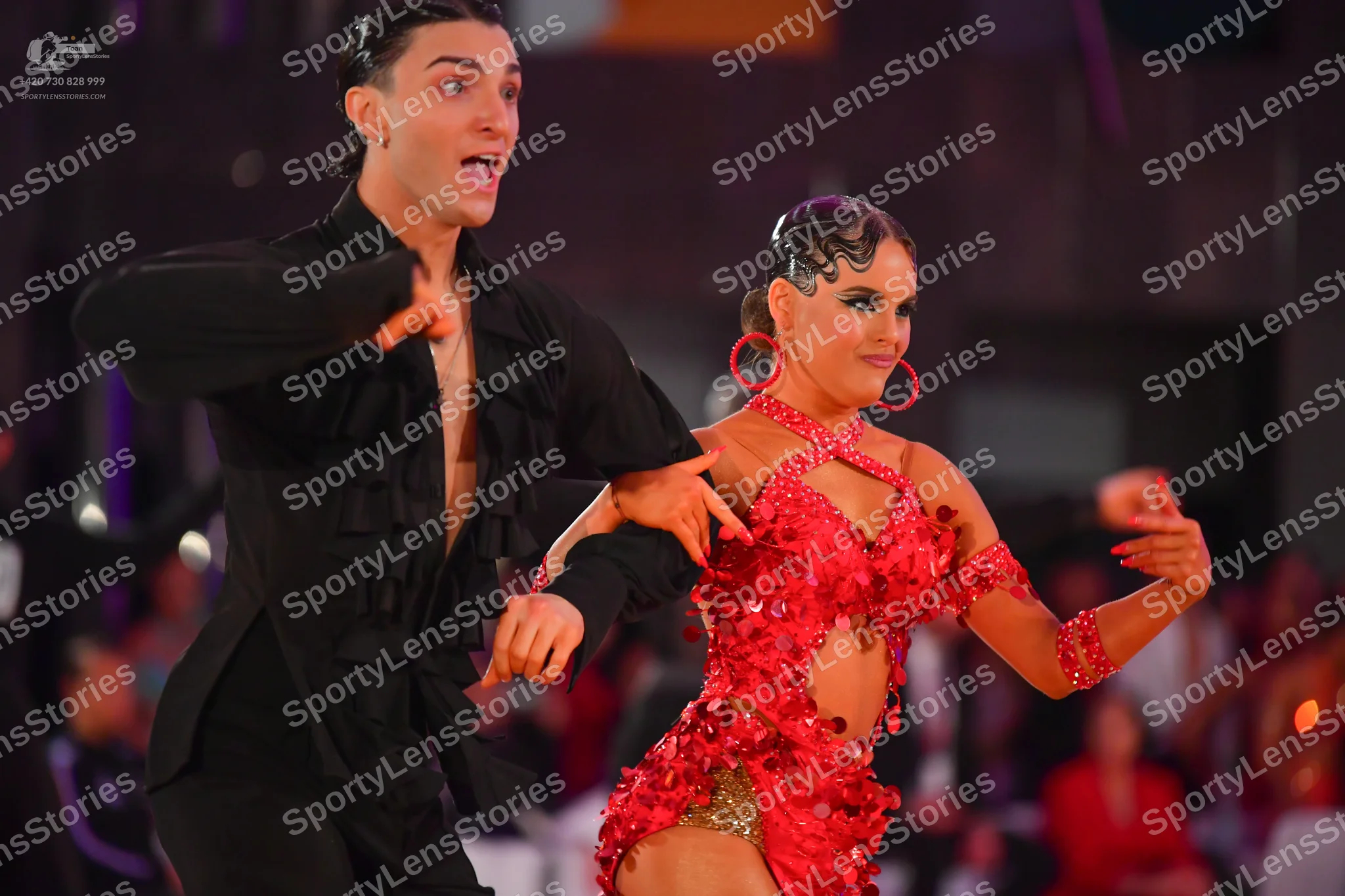 Dancesport competitor: Male dancer: black long-sleeved Latin dance shirt with ruffles on the front and
